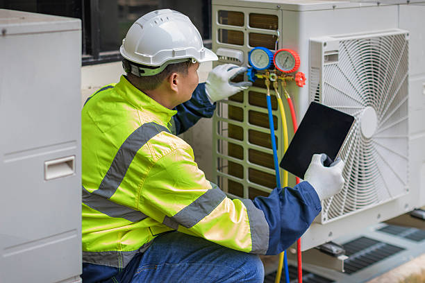 Professional Emergency Ac Repair technician working in Rossville, IL